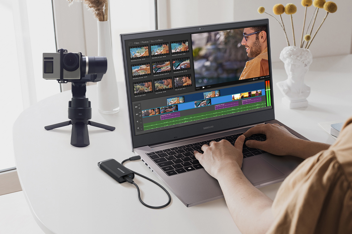 person editing video on computer with Samsung SSD T5 EVO